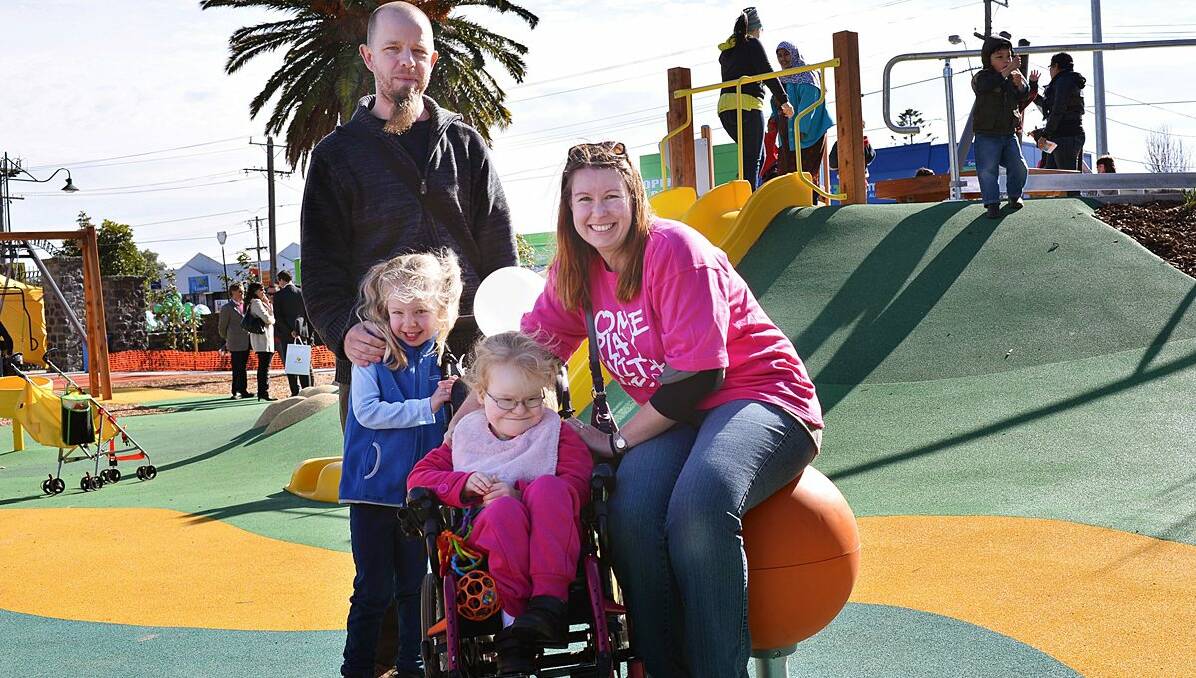 Ballarat family Bec and Tim Paton, with their daughters Hannah, left, and Sarah, at the opening of the St Albans inclusive play space.