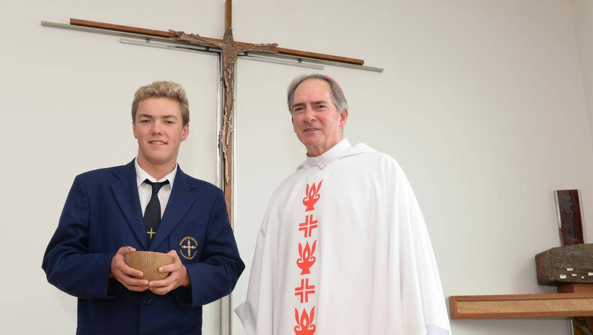 Damascus College year 12 student Daniel Mroczkowski and Ballarat Bishop Paul Bird during the opening and blessing of the new chapel.  PICTURE: KATE HEALY 