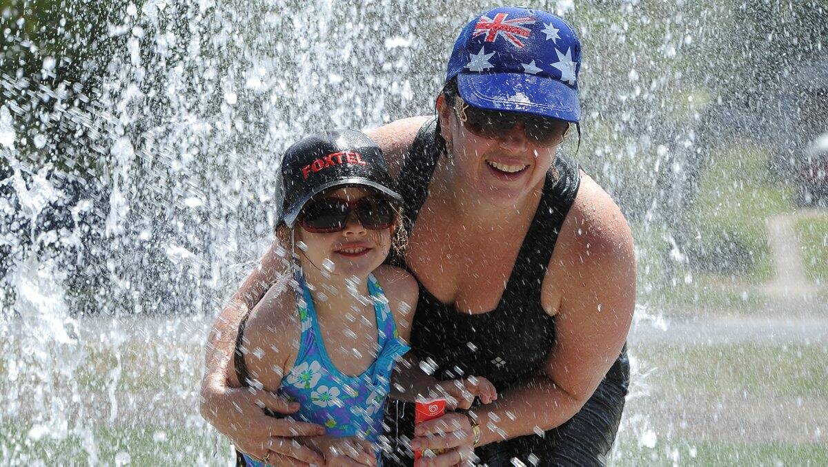 Cassandra Tuffen and four-year-old Imogen Tuffen enjoy the new water park at the Midlands Reserve in Doveton Street. PICTURE: LACHLAN BENCE