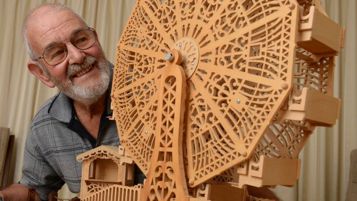 Brian Rickard with the ferris wheel which his friend Ken Williams made before dying of cancer. PICTURE: KATE HEALY