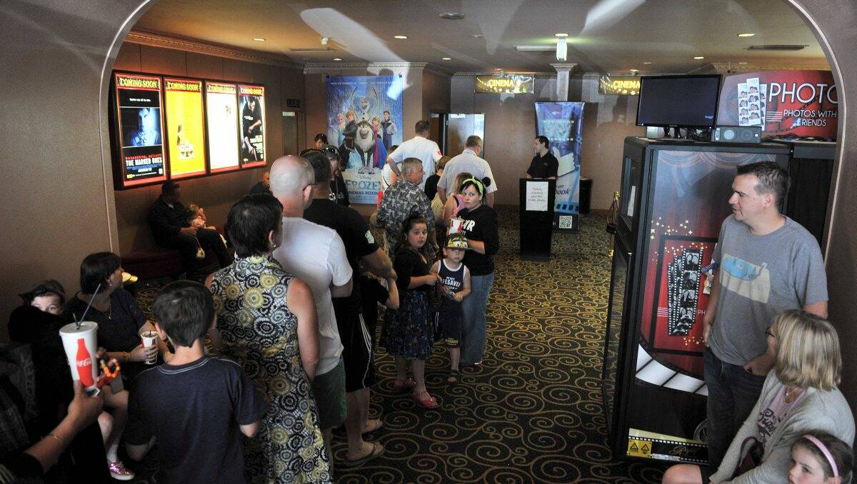 Boxing Day box office: Movie fans queue up at the Regent Cinemas yesterday. PICTURE: LACHLAN BENCE