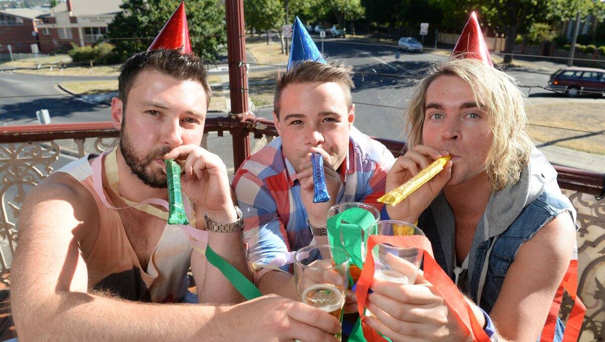 Getting an early start to the New Year’s Eve festivities are, from left, Chris Sargent, Tim Miller and Mitch Perryman. PICTURE: KATE HEALY