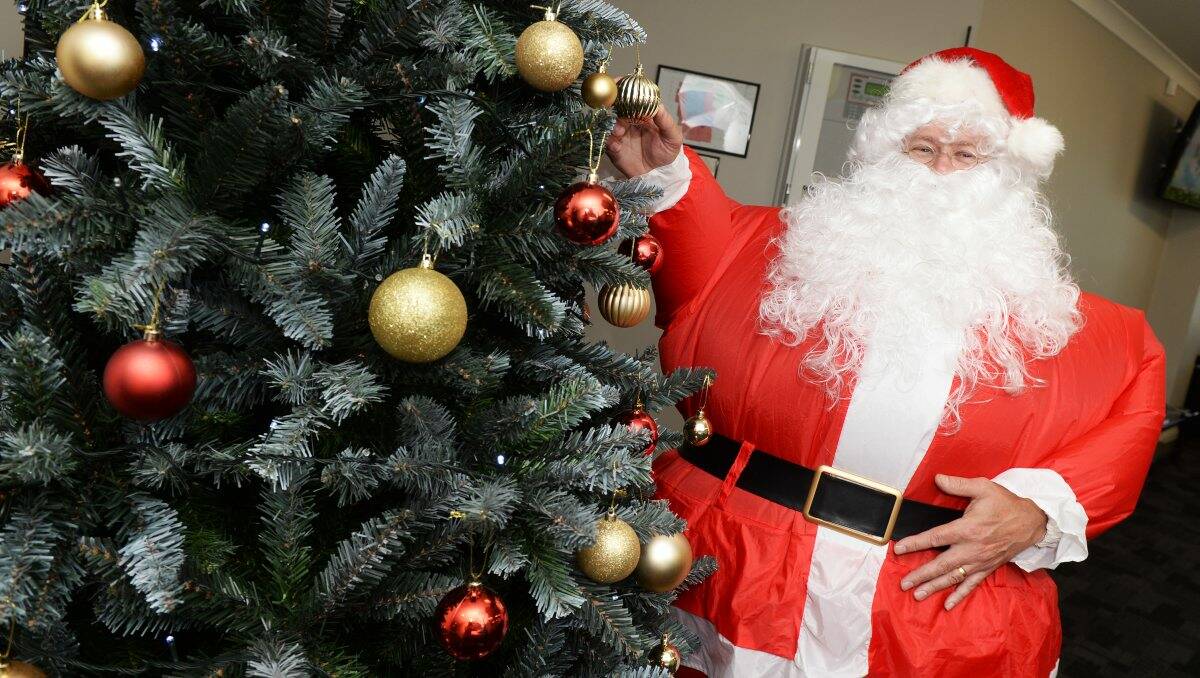 Ho Ho Hot: Santa sweats it out in his sumo suit at the Ballarat Day Procedure Centre. 