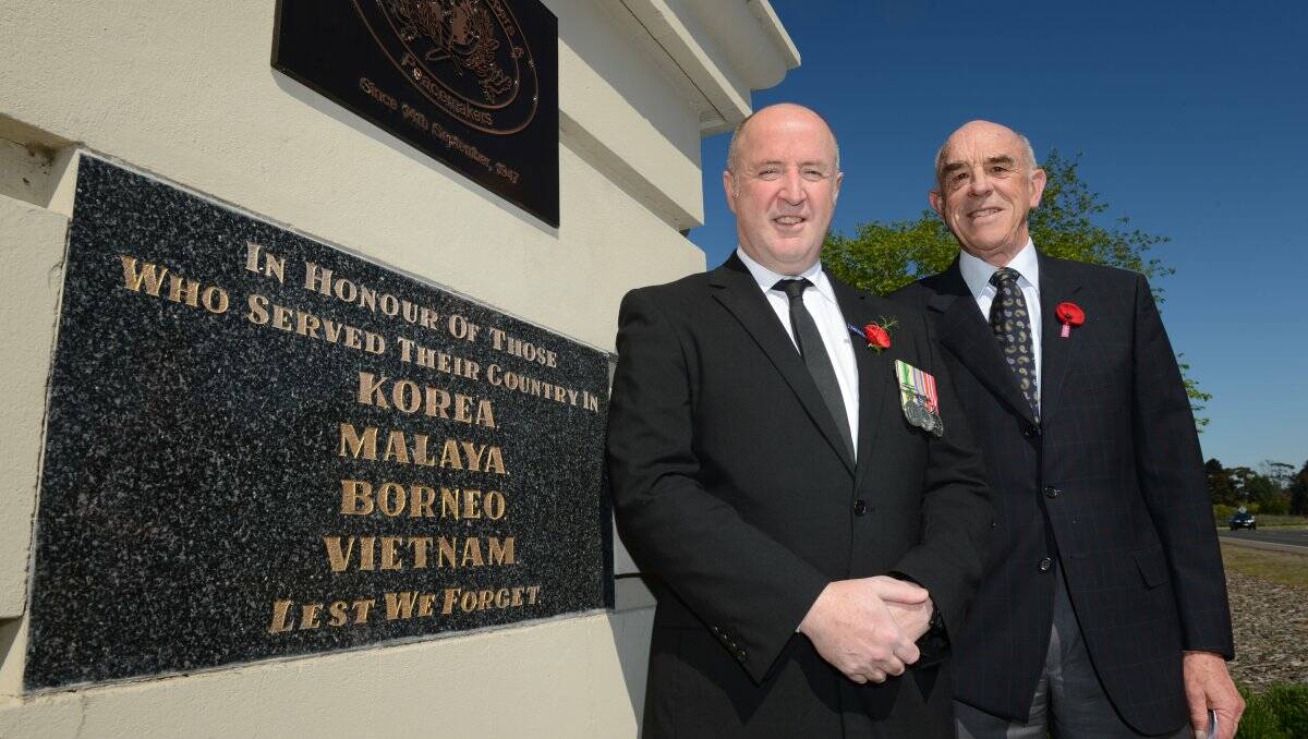  Former Ballarat mayor and reservist medical officer Mark Harris with Arch of Victory and Avenue of Honour committee president Bruce Price beside the plaque.