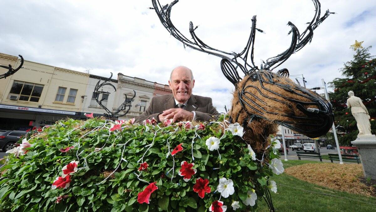  The festive spirit is stirring in Ballarat with the arrival of the popular floral reindeers in the 300 block of Sturt Street, as mayor John Burt checks on them in readiness for the City of Ballarat party on December 7. 