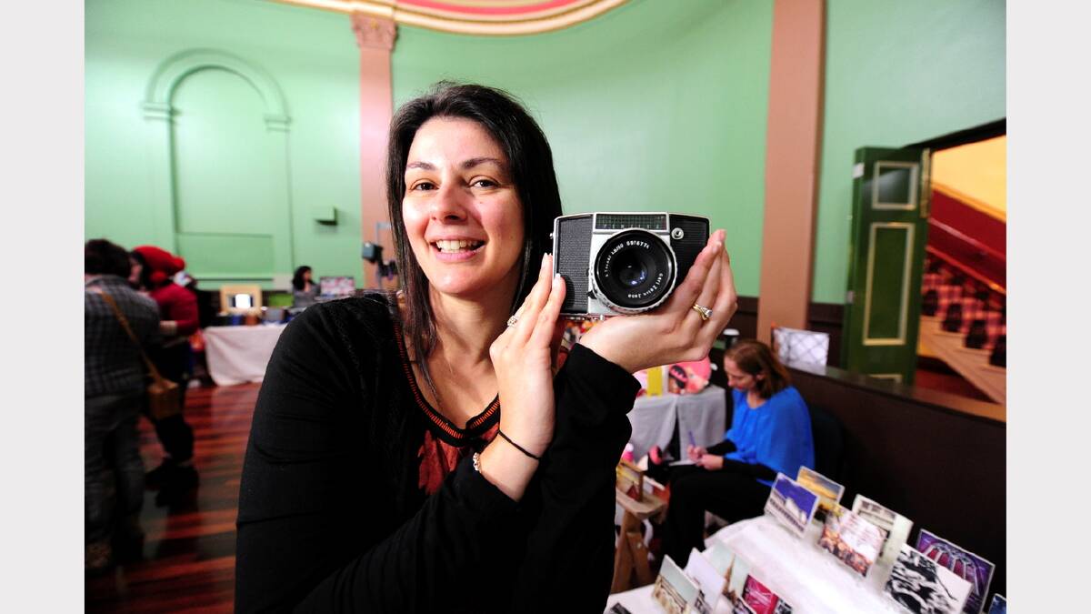 Angie Hay with her photography stall in the craft market   