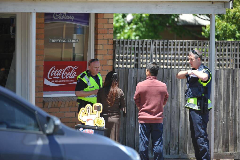 Police talk to the owners of the shop following an attempted armed robbery at a milk bar in Klein Street, Ballarat East today. Picture: Lachlan Bence