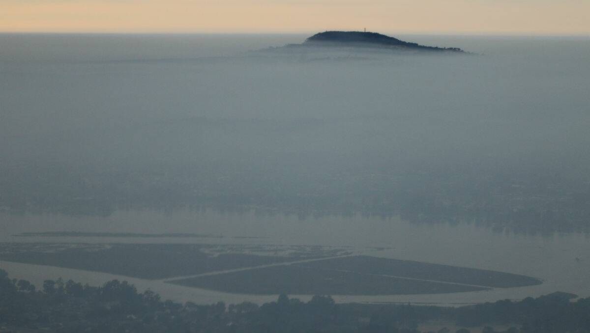 Photographer Ed Dunens took these pictures of Ballarat covered in smoke from the air. PICTURE: ED DUNENS
