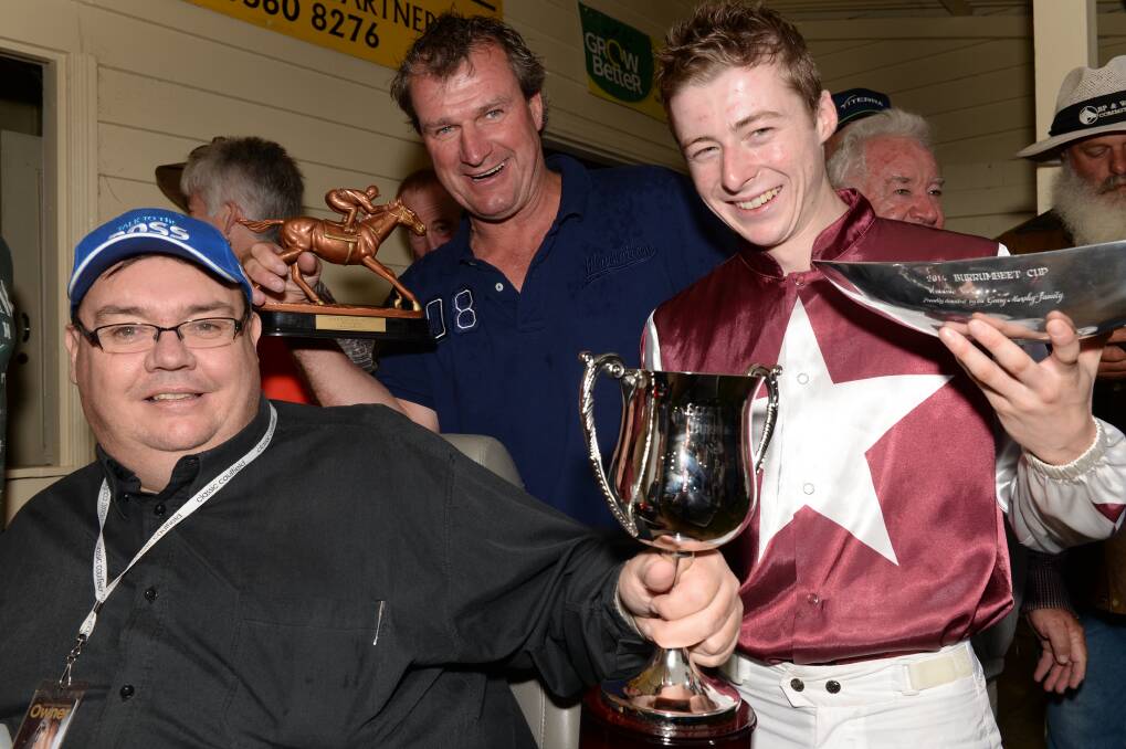 Darren Weir (centre) after his win in the Burrumbeet Cup on New Year's Day.