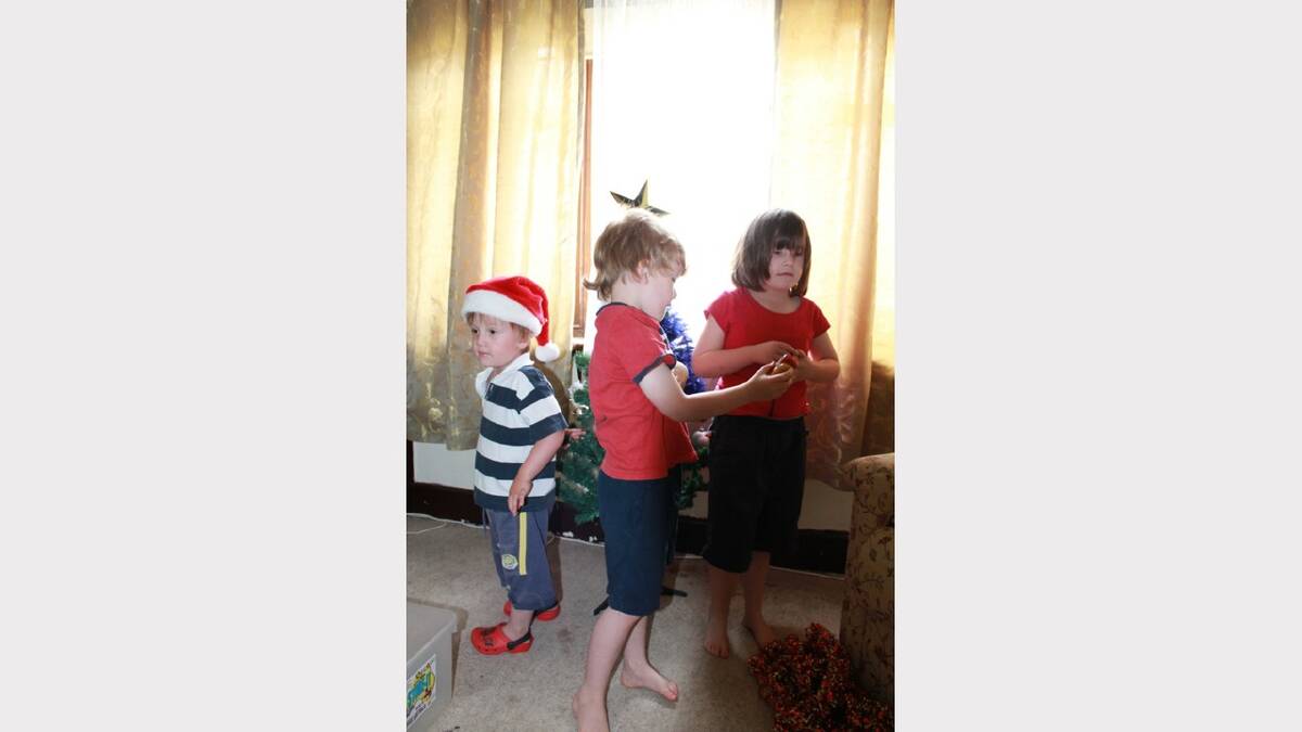 Our 3 children last year. All 3 are autistic and our middle child Tom was the one to show the others how to decorate the tree. I am proud of them all. Submitted by reader Karen Kennedy. 