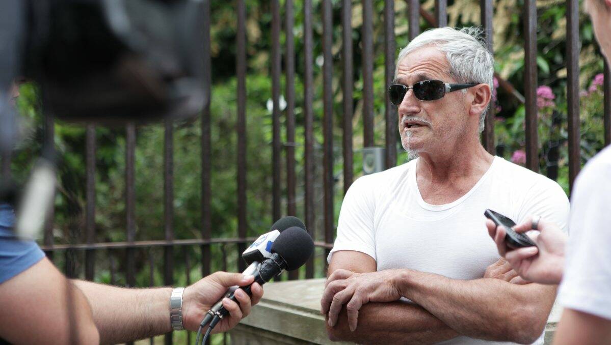 TERRIFYING: James Frangos talks to the media outside his Webster Street home the day after he and his family were held hostage at gunpoint in December 2010. PICTURE: ADAM TRAFFORD 