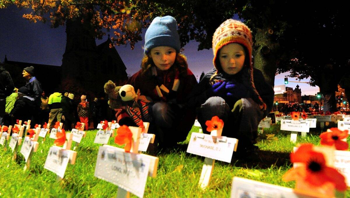 Molly and Wilby Fredericks. Thousands have attended this year's Anzac Day dawn service at the Cenotaph in Sturt Street. PICTURE: JEREMY BANNISTER