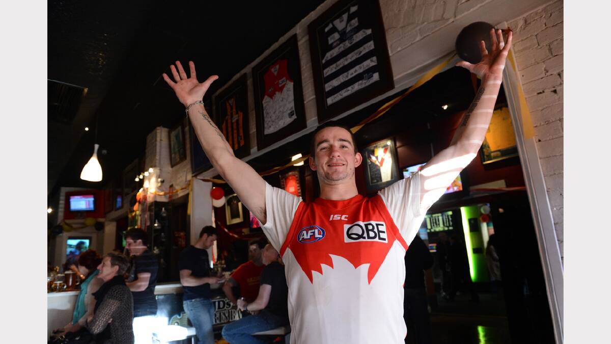 Dean McPhan celebrates the win at JDs Sports Bar. PICTURE: ADAM TRAFFORD