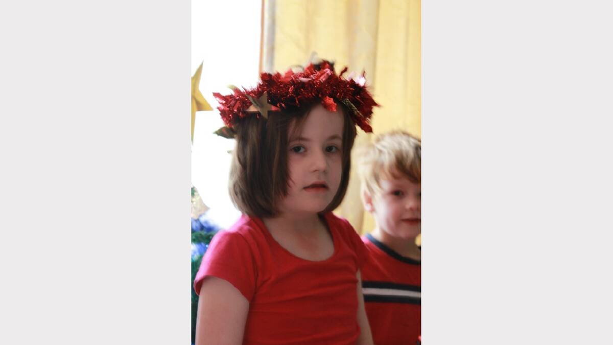 This picture was taken a year ago and our autistic daughter placed our door wreath on her head and we thought she looked like a Christmas angel. Submitted by reader Karen Kennedy. 