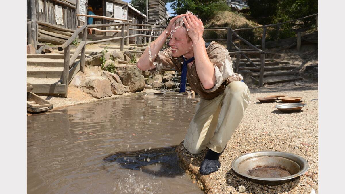 Rob Muirhead cooling off in the creek at Sovereign Hill. PICTURE: KATE HEALY