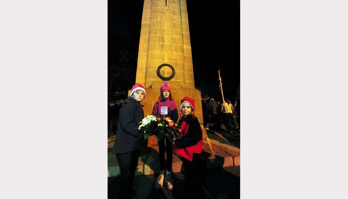 Lily, Ruby and Alice Delaney lay a wreath at the Cenoptaph. Thousands have attended this year's Anzac Day dawn service at the Cenotaph in Sturt Street. PICTURE: JEREMY BANNISTER