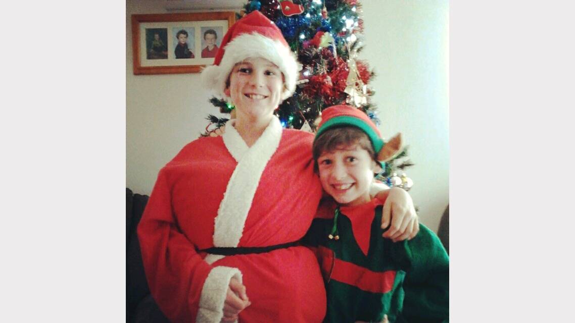 Santas Little helpers. Kirby and Brady Hodgetts getting into the Christmas spirit! Submitted by reader Alena Hdogetts. 
