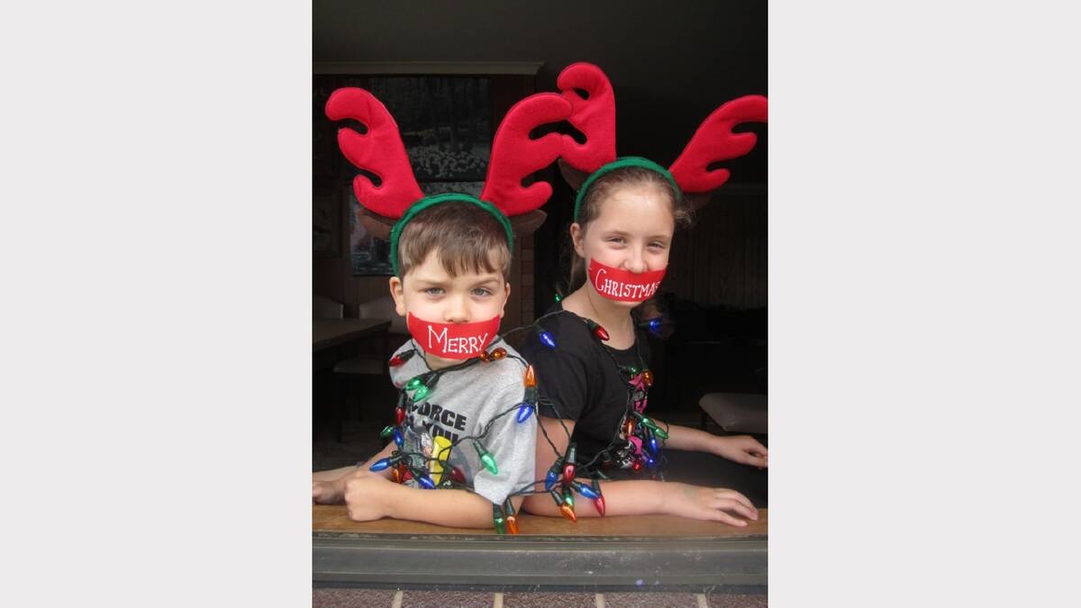 The photo is of my two kids Jed and Piper tied up with Christmas lights and a Merry Christmas message on their mouths in gaffa tape. "Here's wishing you a Silent Night!" Submitted by reader Jackie McPhan. 