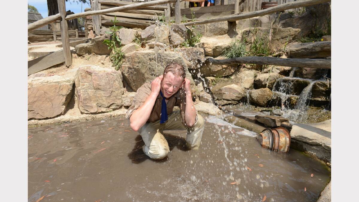 Rob Muirhead cooling off in the creek at Sovereign Hill. PICTURE: KATE HEALY.
