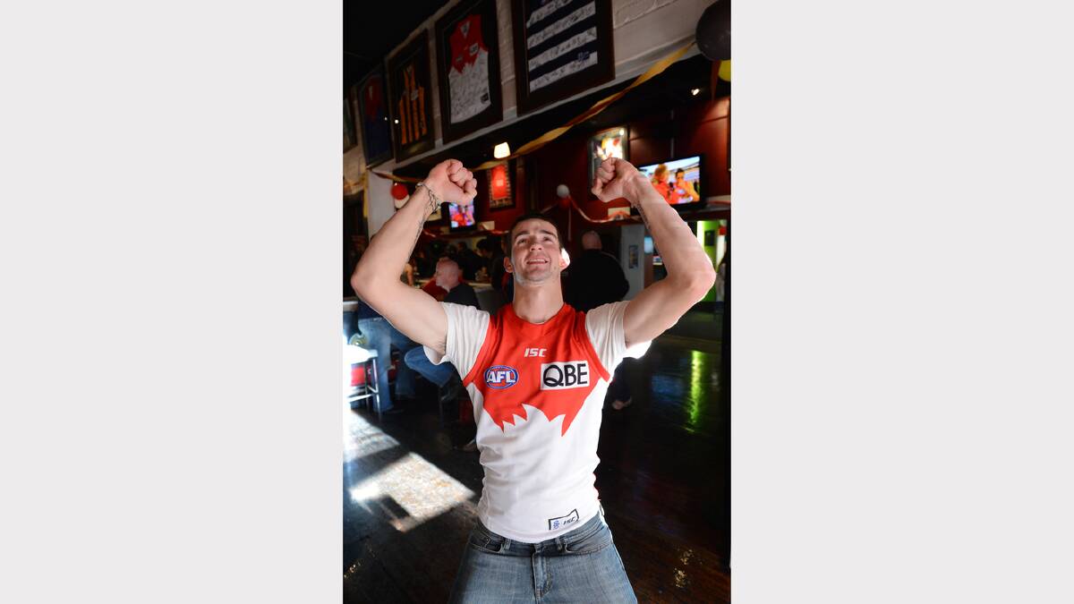Dean McPhan celebrates the win at JDs Sports Bar. PICTURE: ADAM TRAFFORD