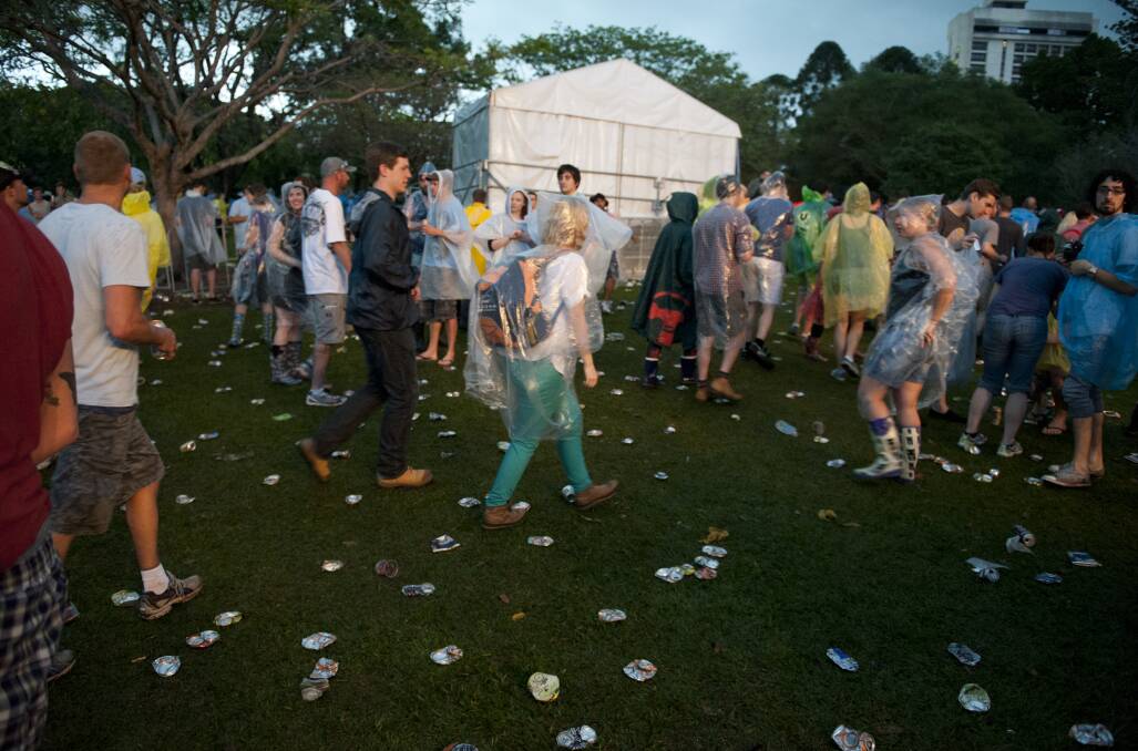 Crowds exit because of a storm warning at the 2012 Harvest Festival held at the city Botanic Gardens in Brisbane. Photo: Harrison Saragossi.