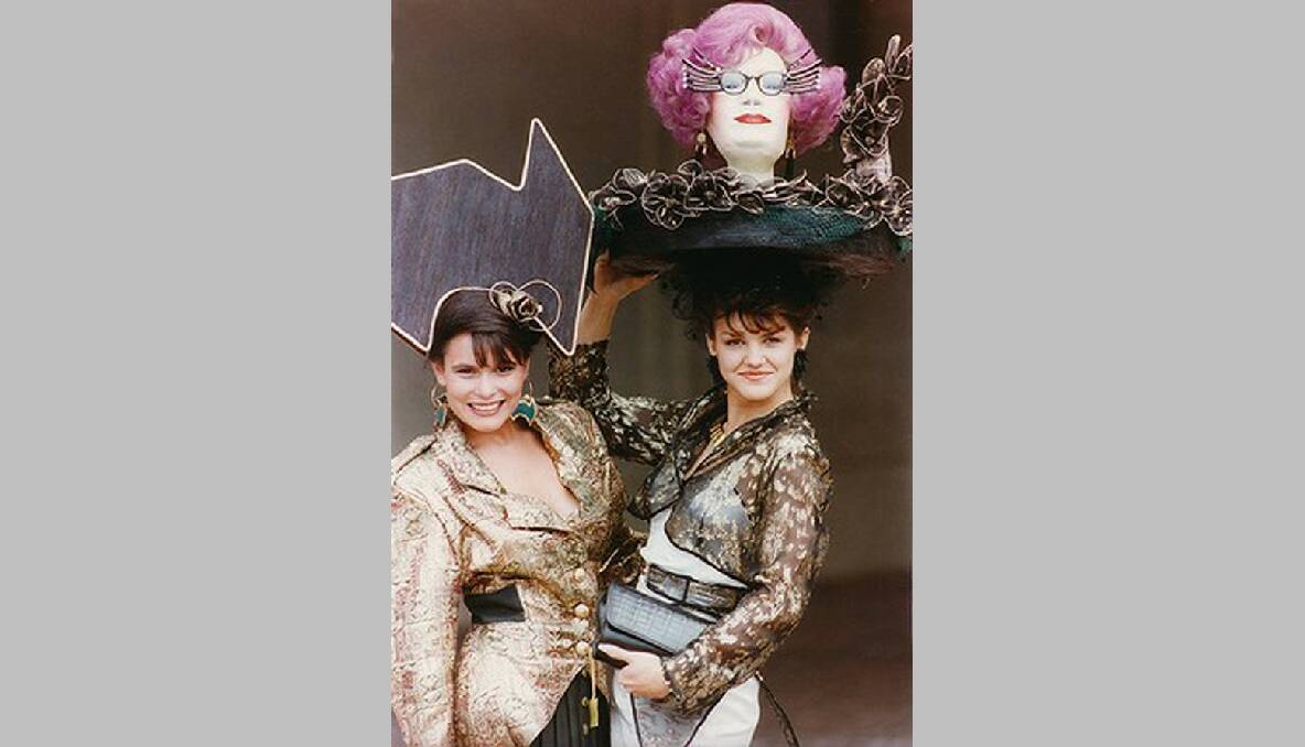 Dagmar Styck (wearing the Dame Edna hat) and Teresa Rodriguez at the VRC Spring Racing Carnival, 1990.