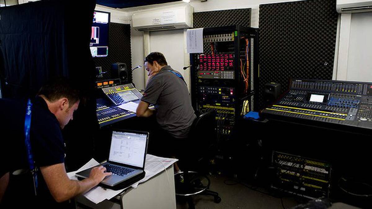 Sound technicians Nick Bowey (left) and Lincoln Sharpe work for Channel 7, Melbourne Park. Photo: Paul Jeffers