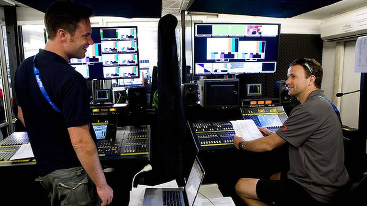 Sound technicians Nick Bowey (left) and Lincoln Sharpe work for channel 7 during the tennis at Melbourne Park. Photo: Paul Jeffers