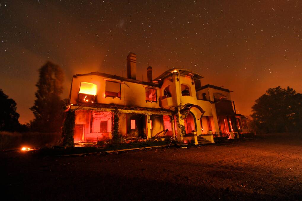 Chepstowe Fires near Ballarat. Cargnham Station burns on into the night the historic Villa was completely destroyed in the fires. Photo: Justin McManus