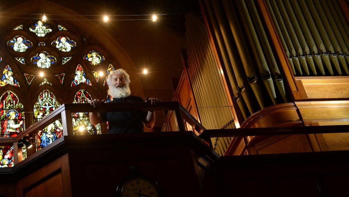Organ maintenance technician Ken Turner checks the organ at St Patrick’s Cathedral. 