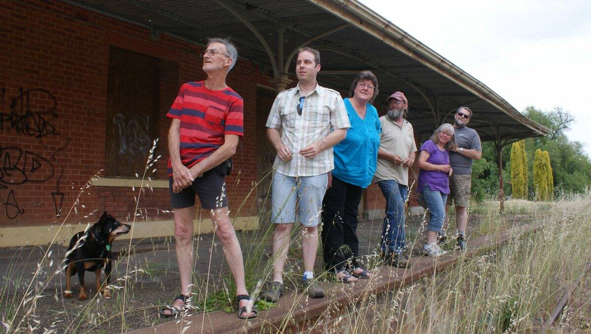 Rail Revival Alliance committee members inspect the Carisbrook Railway Station ahead of the rail revival rally.