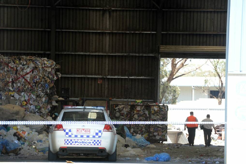 Police at Vatmi Recycling plant in Bendigo where it is believed a wallet linked to the murders was found