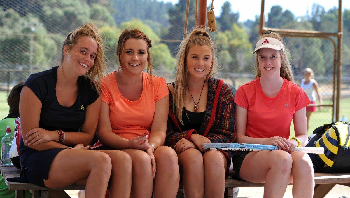 Geelong’s Lily Smith, 14, Jacinta Smith, 17, Savannah Matthews, 14, and Claire Fitzgerald, 15, enjoy a break in day four of country week tennis at Creswick yesterday. PICTURE: LACHLAN BENCE
