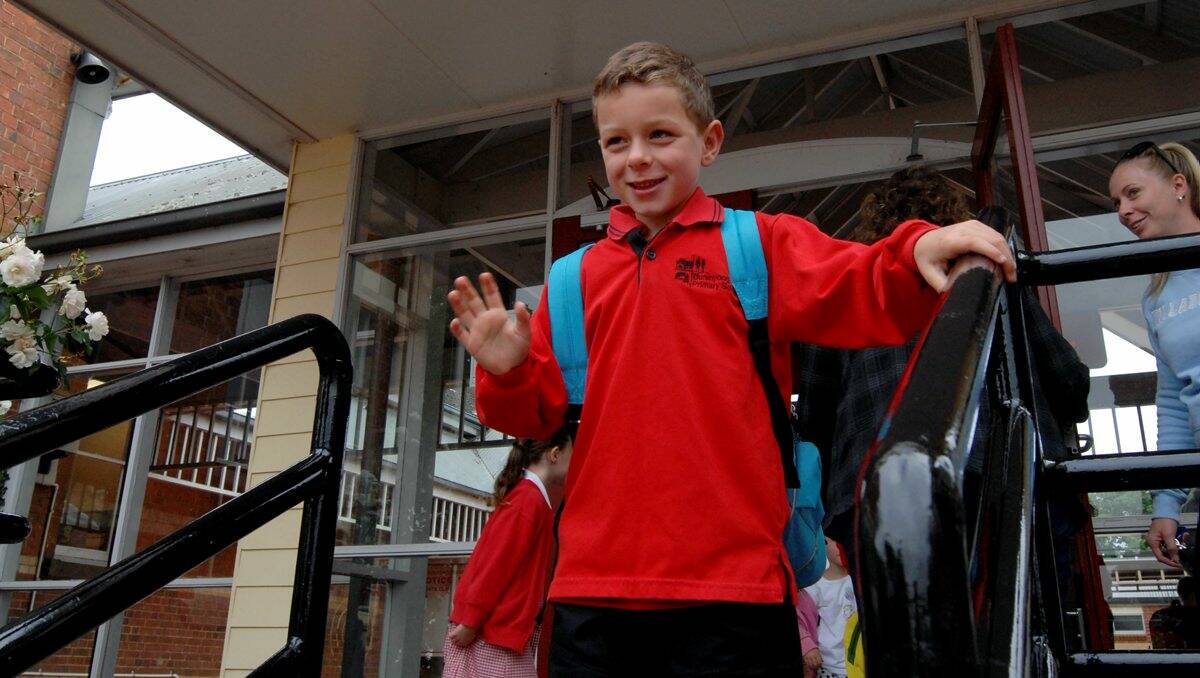 New start: Ryley Verdoorn waves goodbye as he arrives for his first day at Buninyong Primary School yesterday. PICTURE: JEREMY BANNISTER