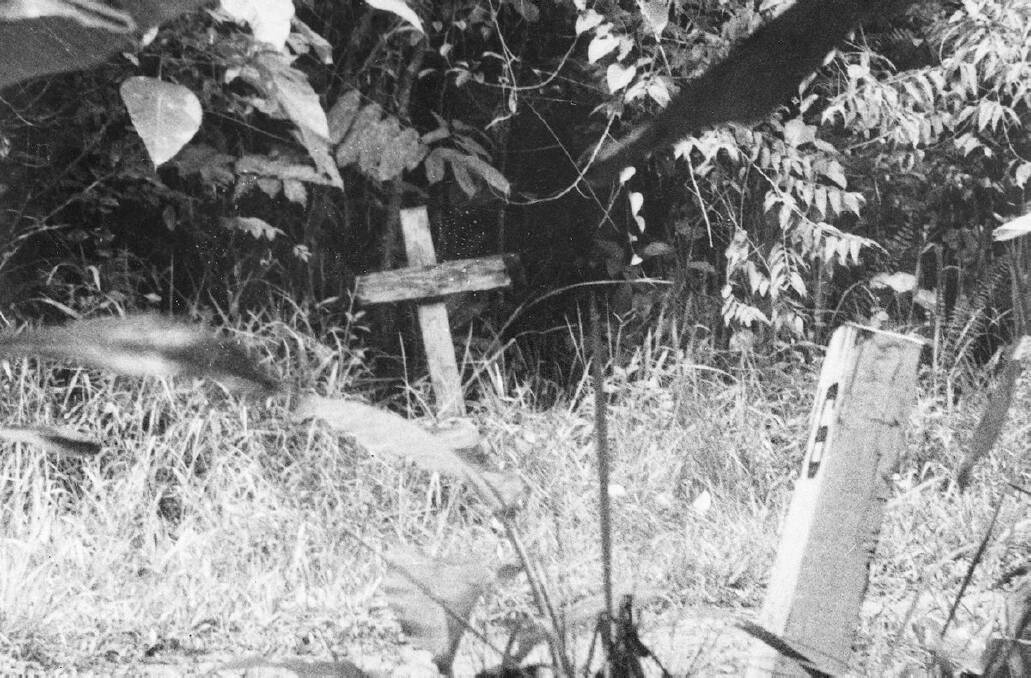 One of the many graves along the route of the Sandakan-Ranau Death Marches. This man was shot trying to escape and was buried by a native gardener near the 16 mile peg. 042578. Courtesy of the Australian War Memorial.