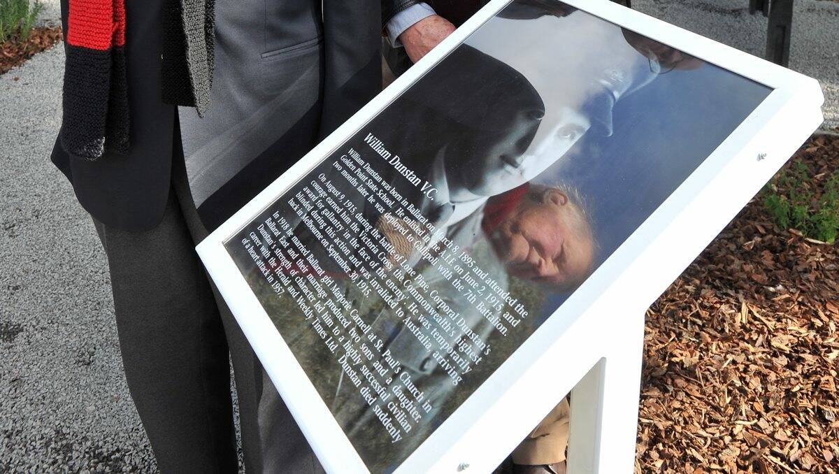 Remembered: Keith Dunstan, reflected in the plaque, was at the unveiling of a memorial plaque for his father Corporal William Dunstan VC at the former Golden Point State School. PICTURE: LACHLAN BENCE