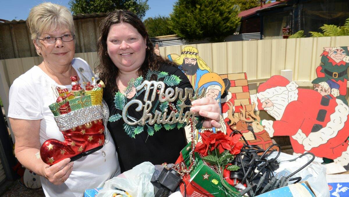 Helen Holmes is donating her Christmas lights to Tamii Stapleton to replace her stolen decorations. picture: KATE HEALY
