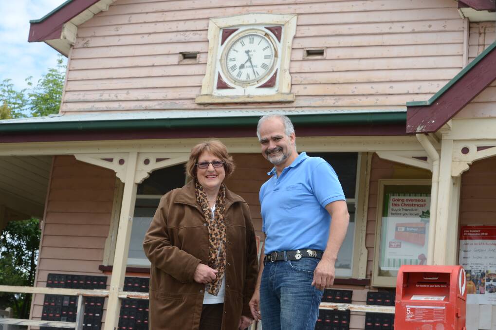 Paddy Mitchell and postmaster Fritz Voser are ready to restart the historic clock at the 1890s Gordon Post Office. PICTURE: KATE HEALY 