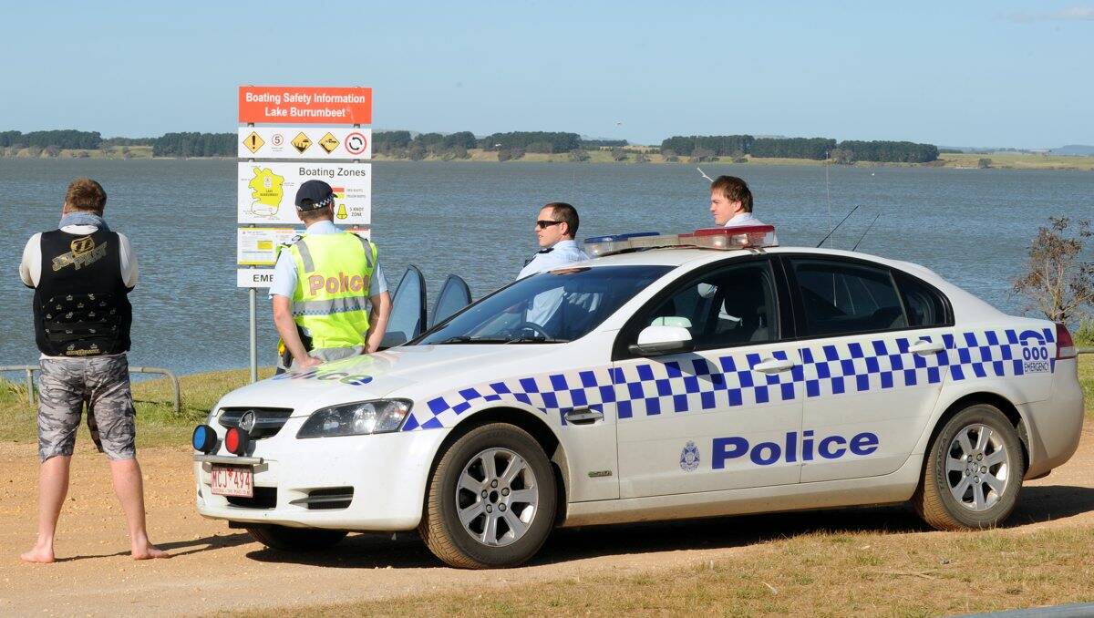 Search: Police wait for the abandoned jet ski to be recovered. PICTURE: JUSTIN WHITELOCK