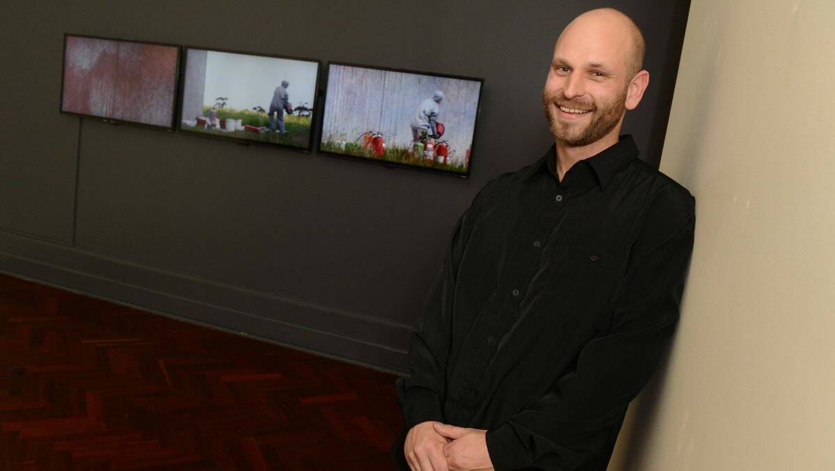 Prize: Winning artist Ash Keating with his work West Park Proposition (2012). PICTURE: KATE HEALY