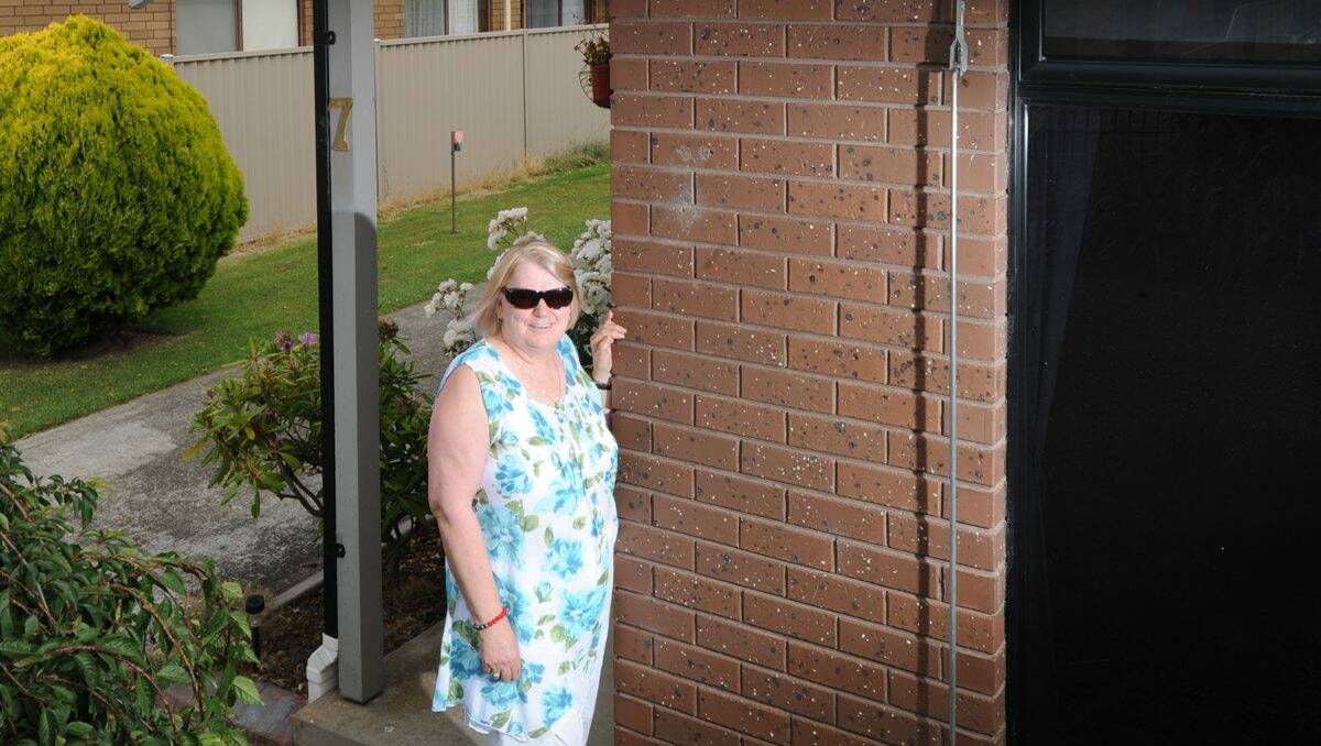 NOT HAPPY: Sandra Gitsham claims her fascia board was damaged during the installation of a smart meter last week. PICTURE: JUSTIN WHITELOCK