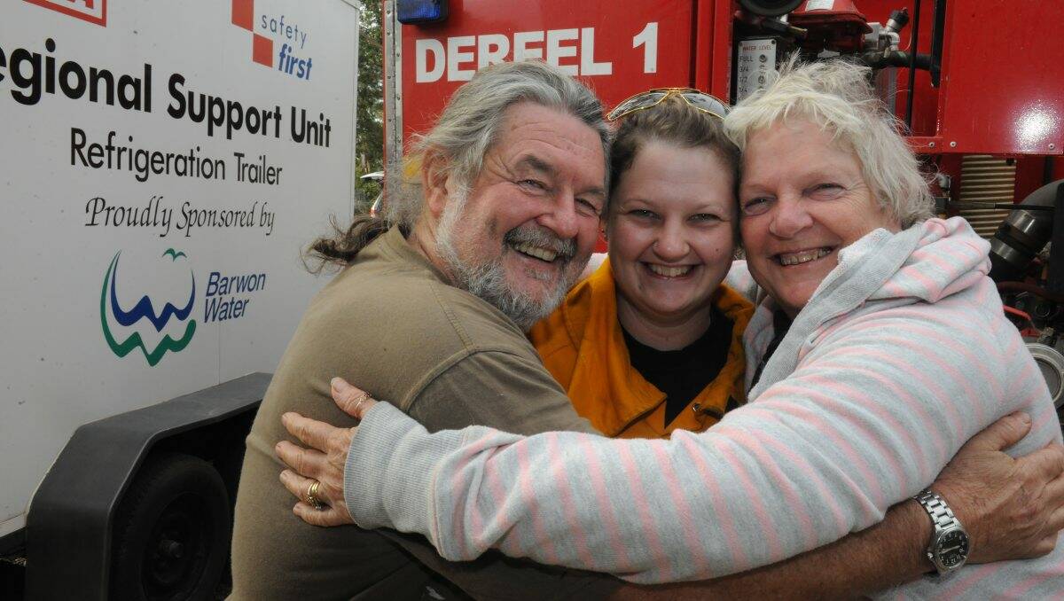 Robert, Hayley and Loretta Butler celebrate their reunion yesterday. PICTURE: LACHLAN BENCE