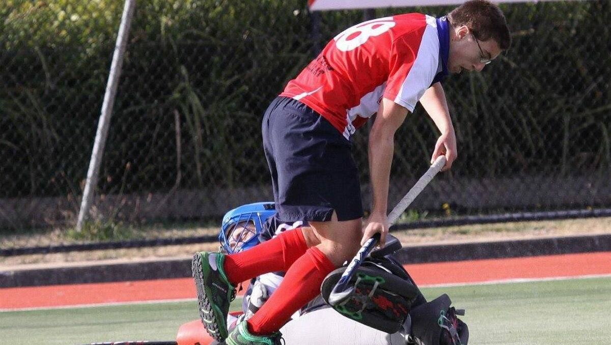 VICTORY: Max Ferrier gets tangled up with the St Bedes goalkeeper at Prince of  Wales Park. Ferrier led a WestVic comeback with two goals in the Hockey Victoria state league two game.