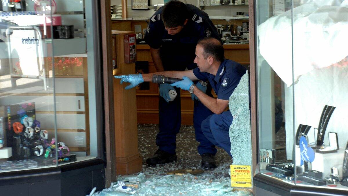 Police at the scene of the Allan Brothers Jewellers break-in on Monday.