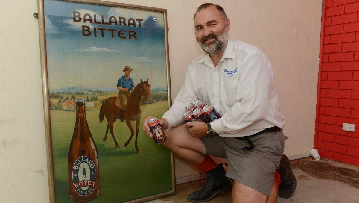 Dean Kittelty with an original Ballarat Bitter Pub oil painting dating back to the 1950s.