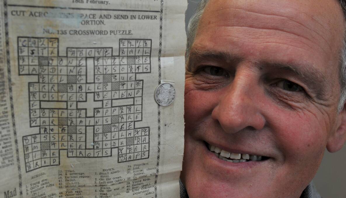 Bryan Whitecross with the completed crossword, all correct and only 78 years late. PICTURE: LACHLAN BENCE