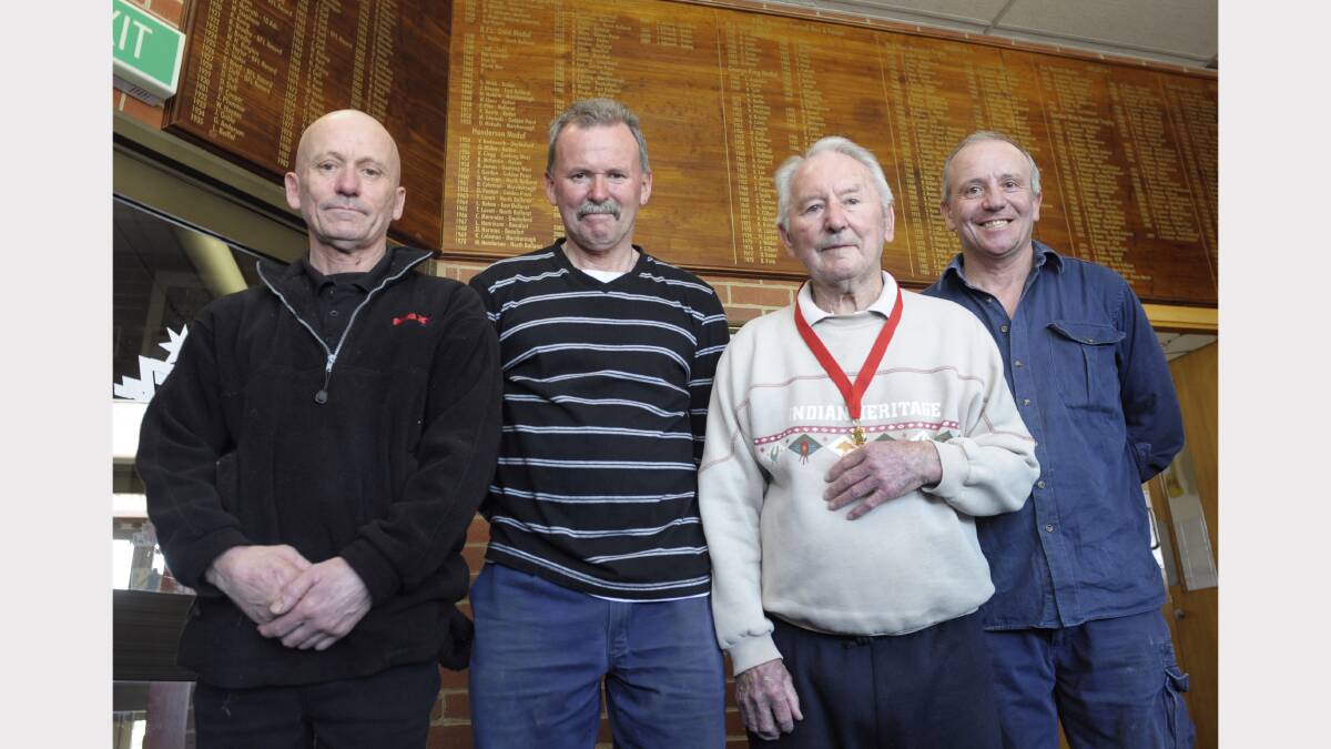 Stan Wallis (second from right) after being awarded his Henderson Medal in 2010, with sons Robert, Bruce and David. Picture: Adam Trafford.