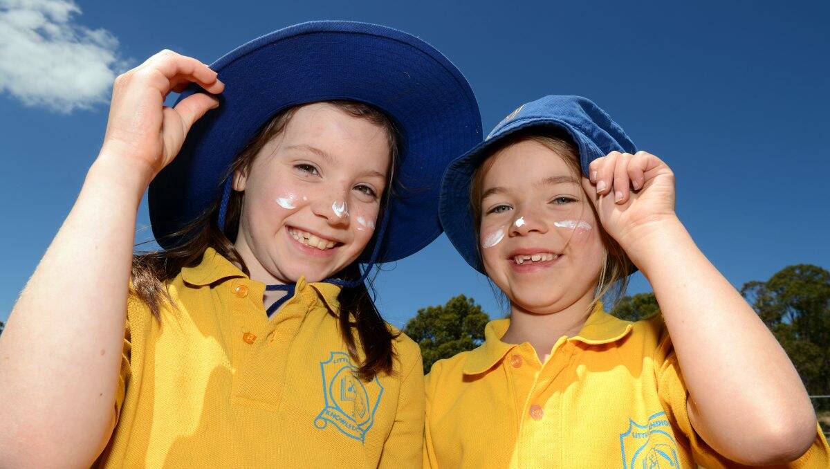 Sun smart: Little Bendigo Primary School pupils Mikala and Aviva, both 7, heed the advice. PICTURE: KATE HEALY