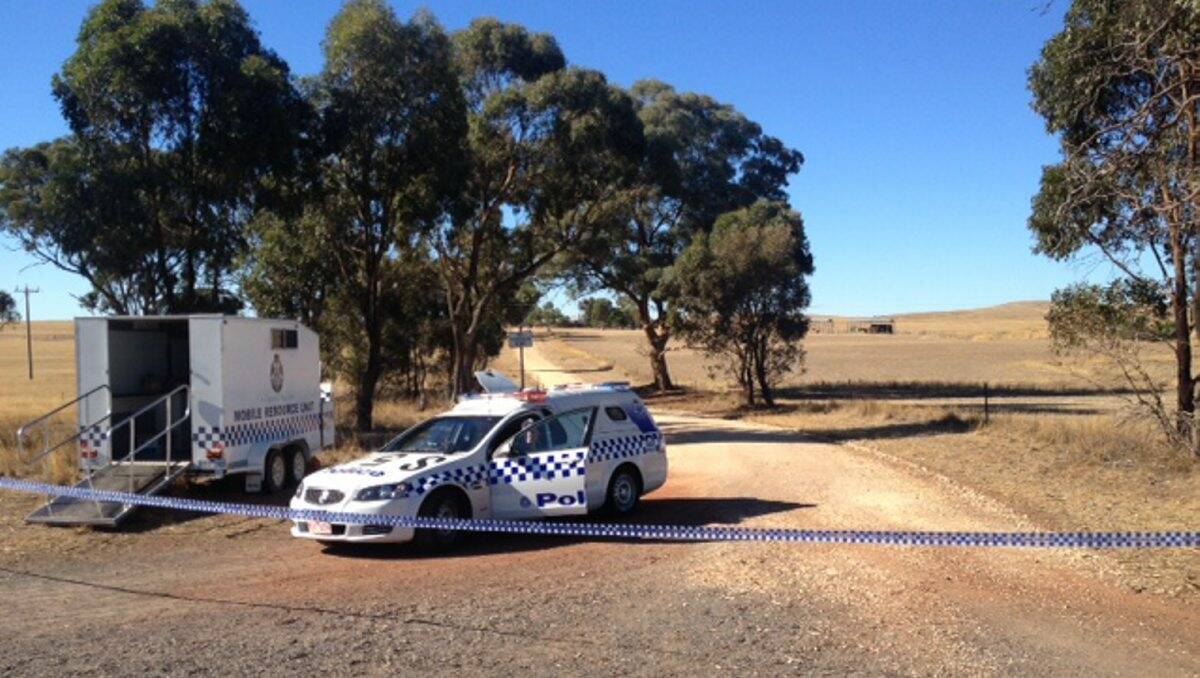 Police at the Natte Yallock farm following the alleged murders.