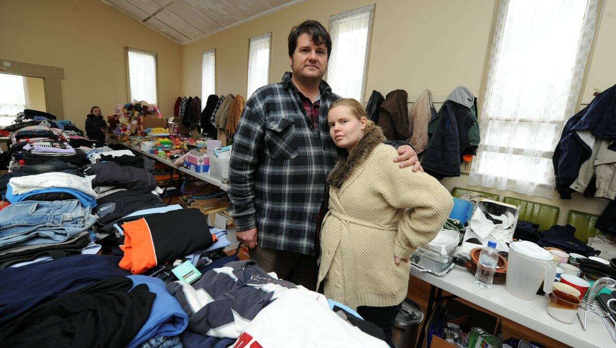 Peter and Victoria Dilley among the many donated goods that have been pouring into the Dereel recovery centre.